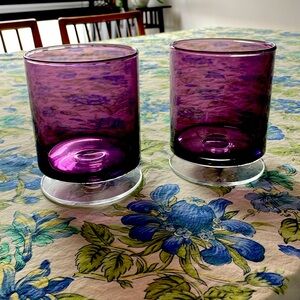 Pair of Crate and Barrel purple glass candle holders. 5.5 inches by 4 inches.